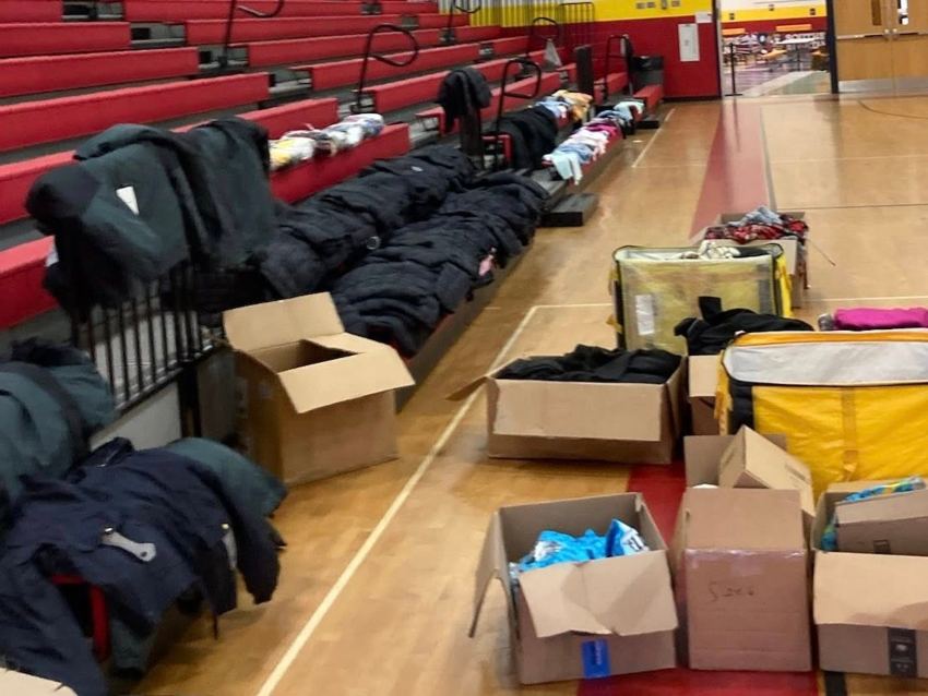 Boxes full of winter coats and boots